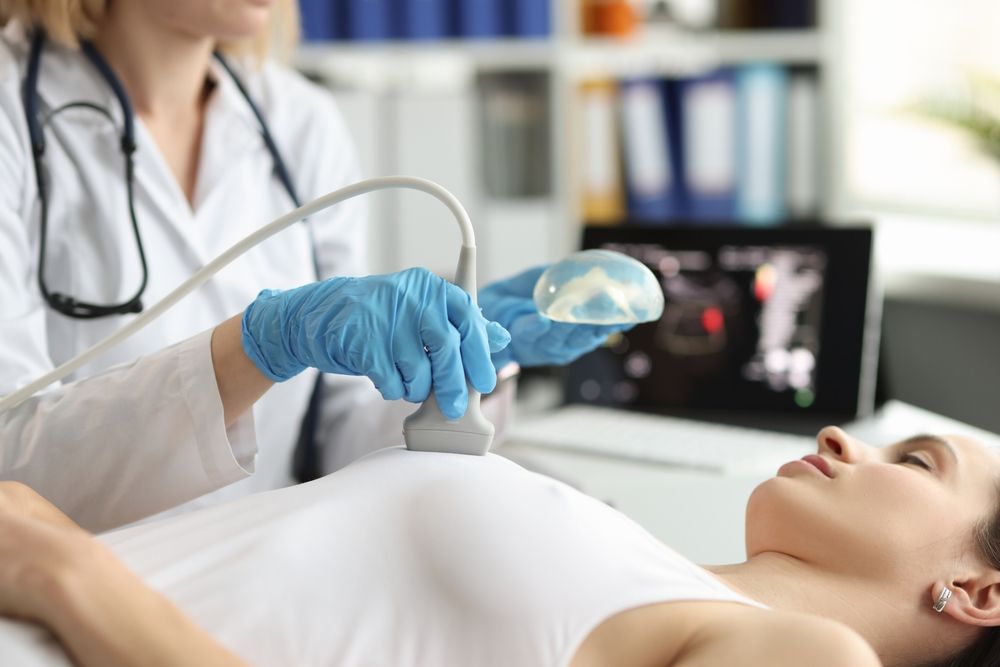 The,Doctor,Makes,A,Woman,Breast,Ultrasound,,Blurry