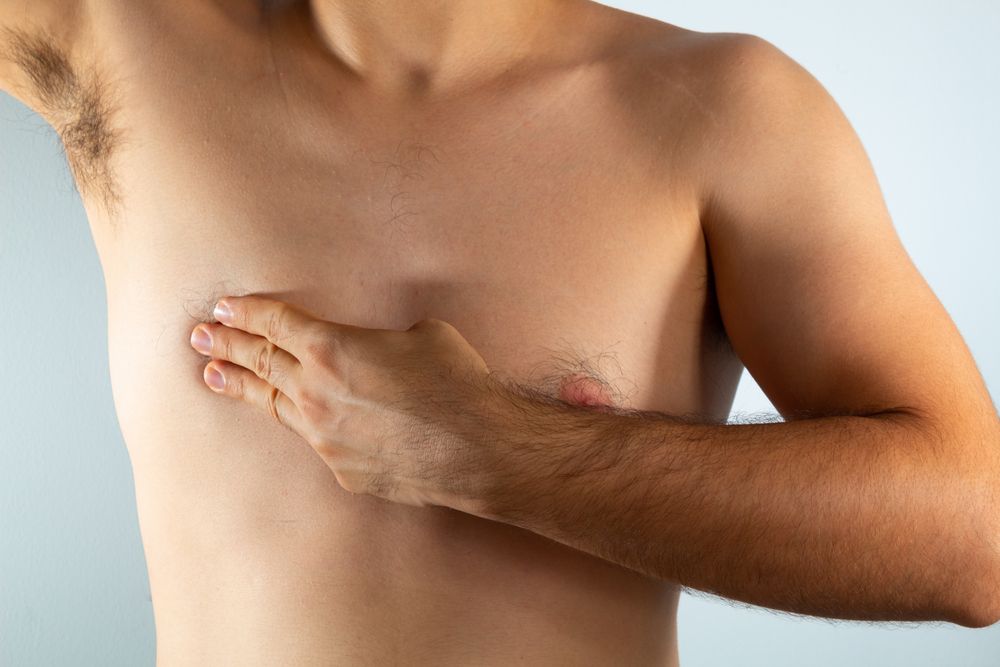 Close,Up,Of,A,Man's,Chest,Looking,For,Signs,Of