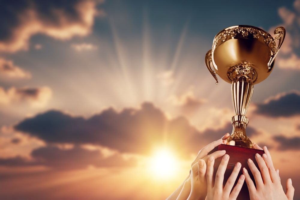 Success,Of,Teamwork,,Team,Holding,Trophy