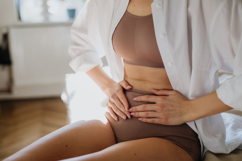 Woman,At,Home,Suffering,From,Menstrual,Pain,,Having,Cramps.,Close