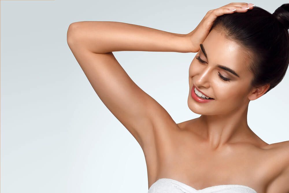 Caucasian beautiful girl holds hair in hand
