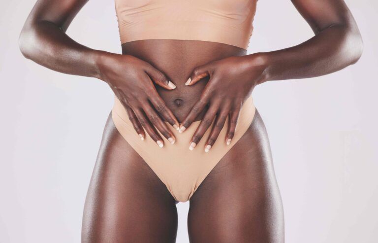 Healthy woman, heart hands and stomach