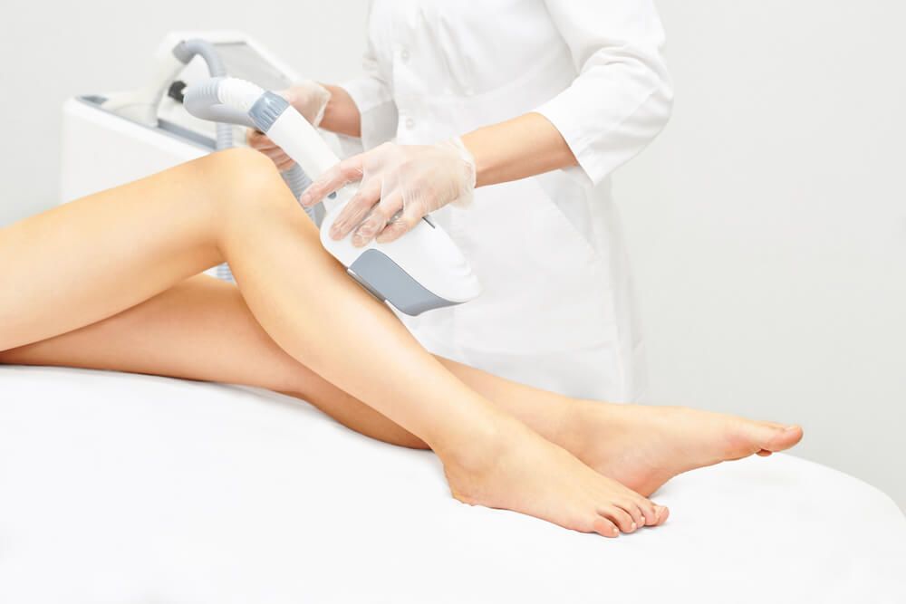 Girl leg during laser IPL treatment