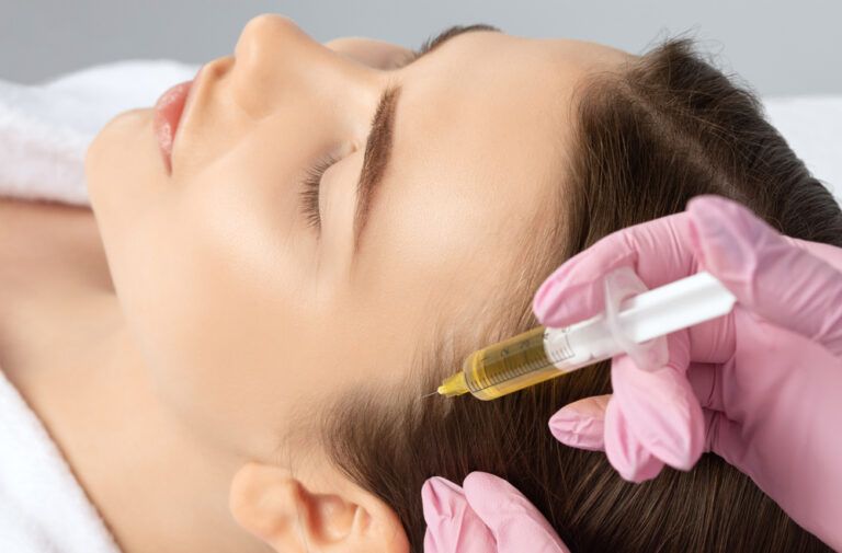 Cosmetologist does prp therapy against hair loss and anti-dandruff of a beautiful woman