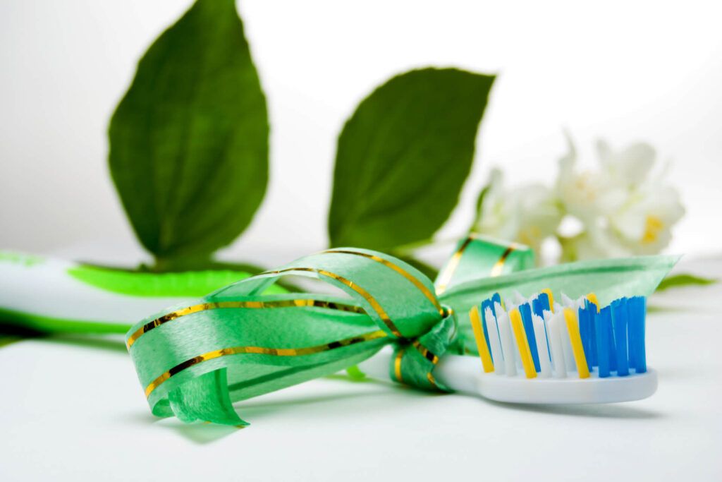 Toothbrush as gift with tied up ribbon