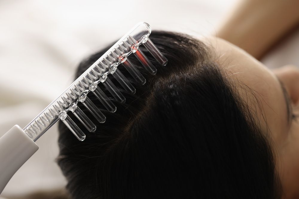 On female hair there is device for restoration of hair follicles. Combating hair loss concept