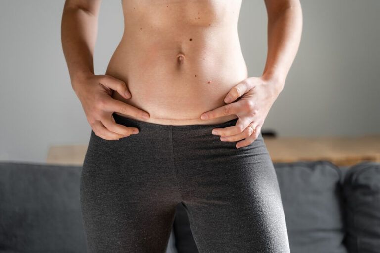 Woman abdomen with cesarean scar