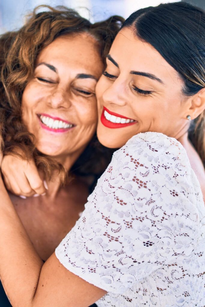 Beautiful mother and daughter smiling happy and confident