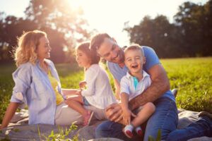 Young family with children having fun in nature