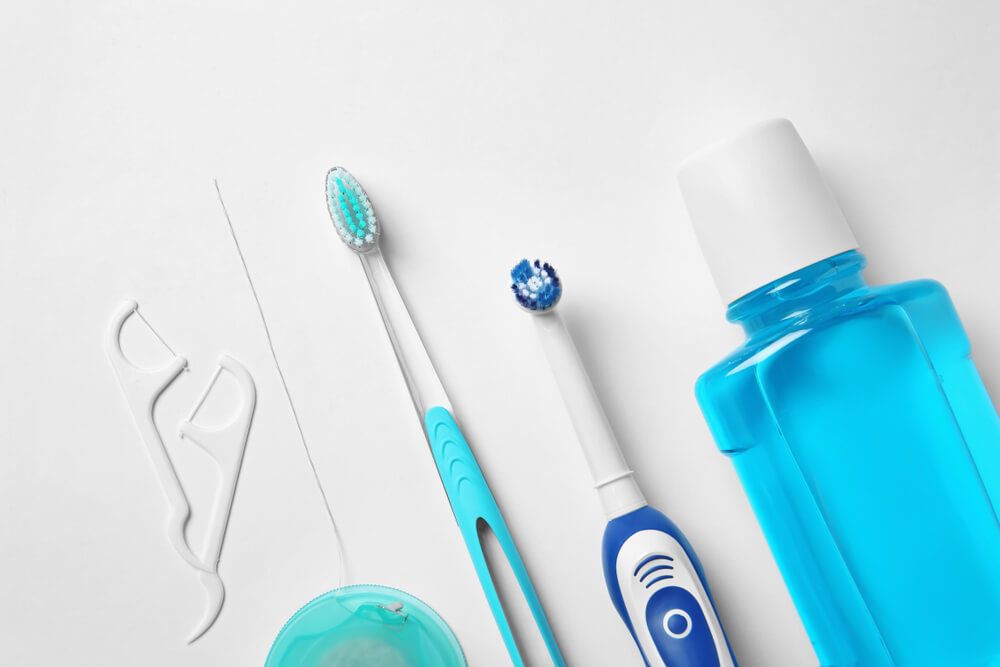 Flat lay composition with toothbrushes and oral hygiene products