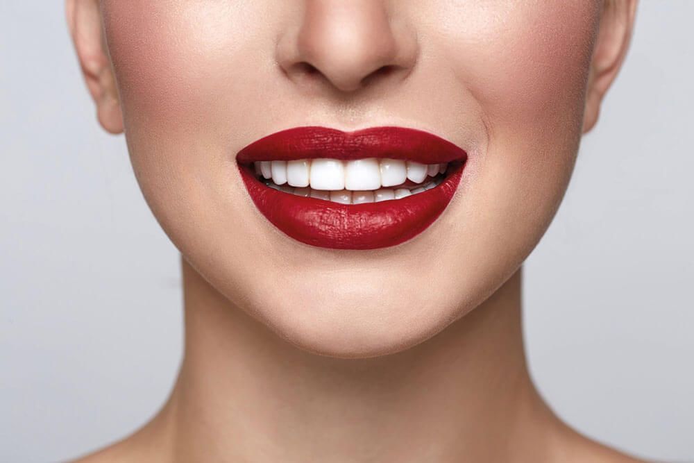 Girl smiling with dark red lipstick