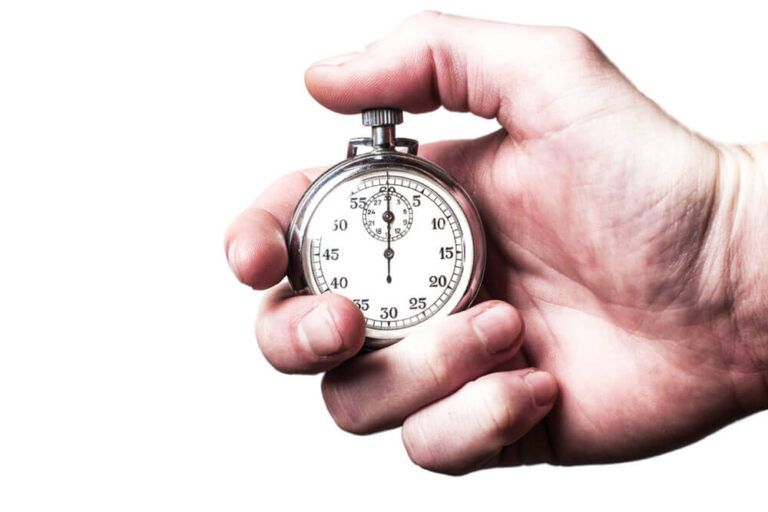 Stopwatch white in man's hand