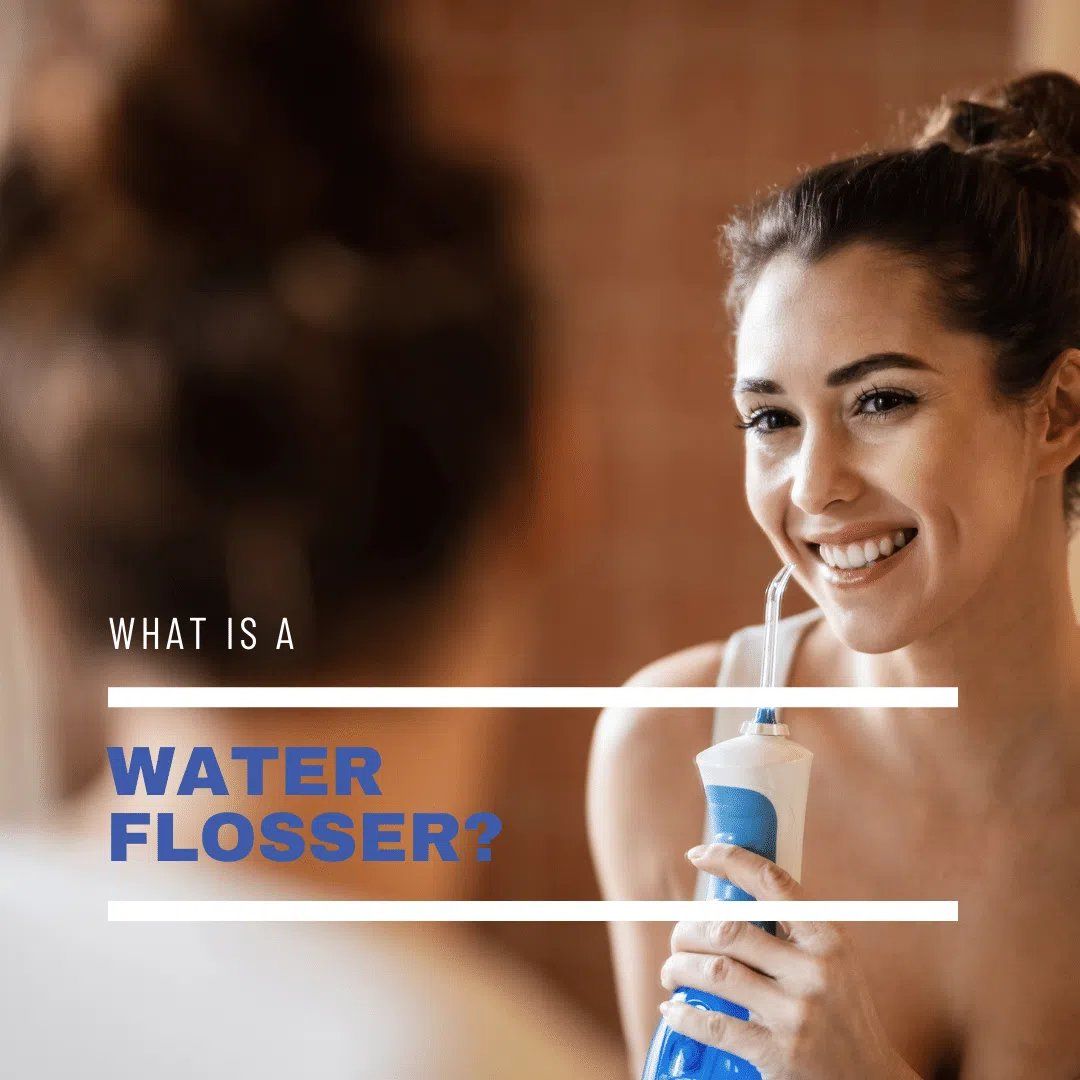 Young beautiful woman using Water Flosser