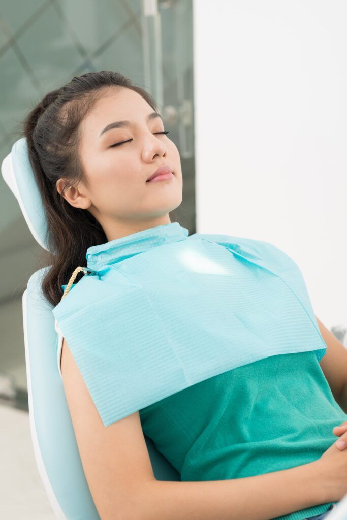 woman sleeping peacefully in dental chair