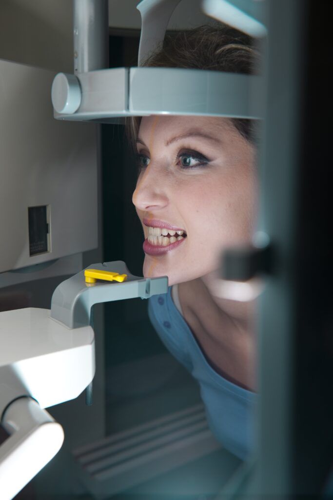 woman having a dental CBCT scan taken