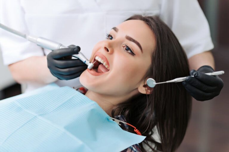 Close-up medical dentist procedure of teeth cleaning