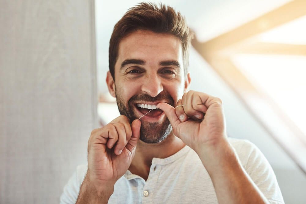 Dental floss, teeth and smile with portrait of man
