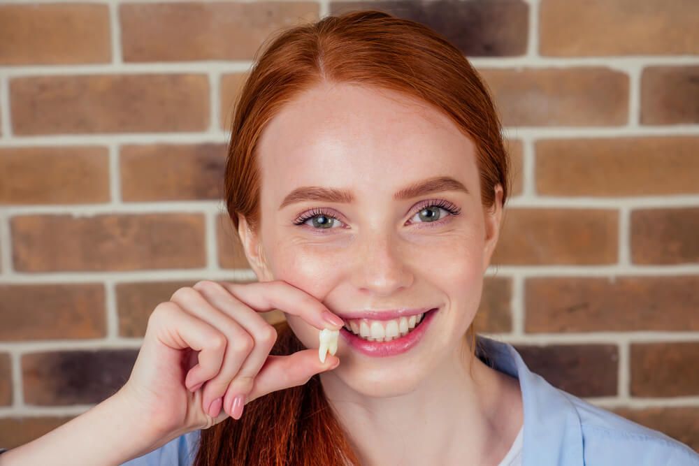 redhaired ginger female with snow-white smile