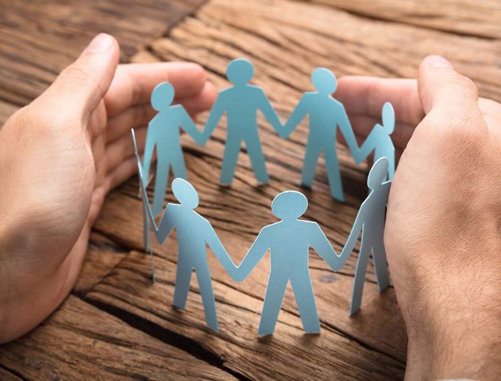 man's hands covering paper team