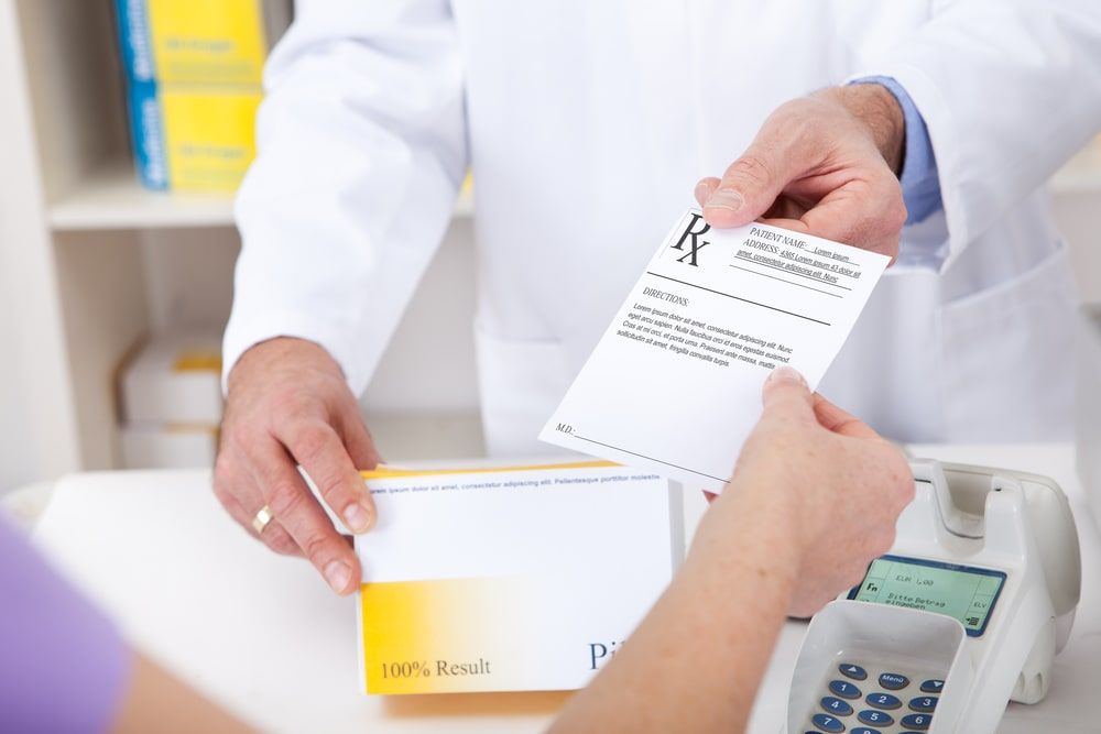 Exchanging prescription for medicine in the drugstore