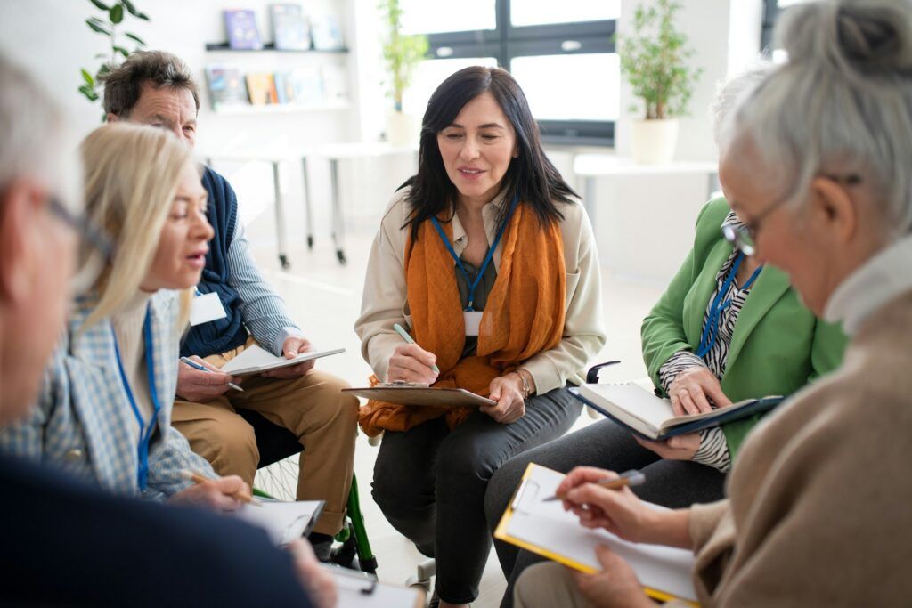 A group of person talking to each other