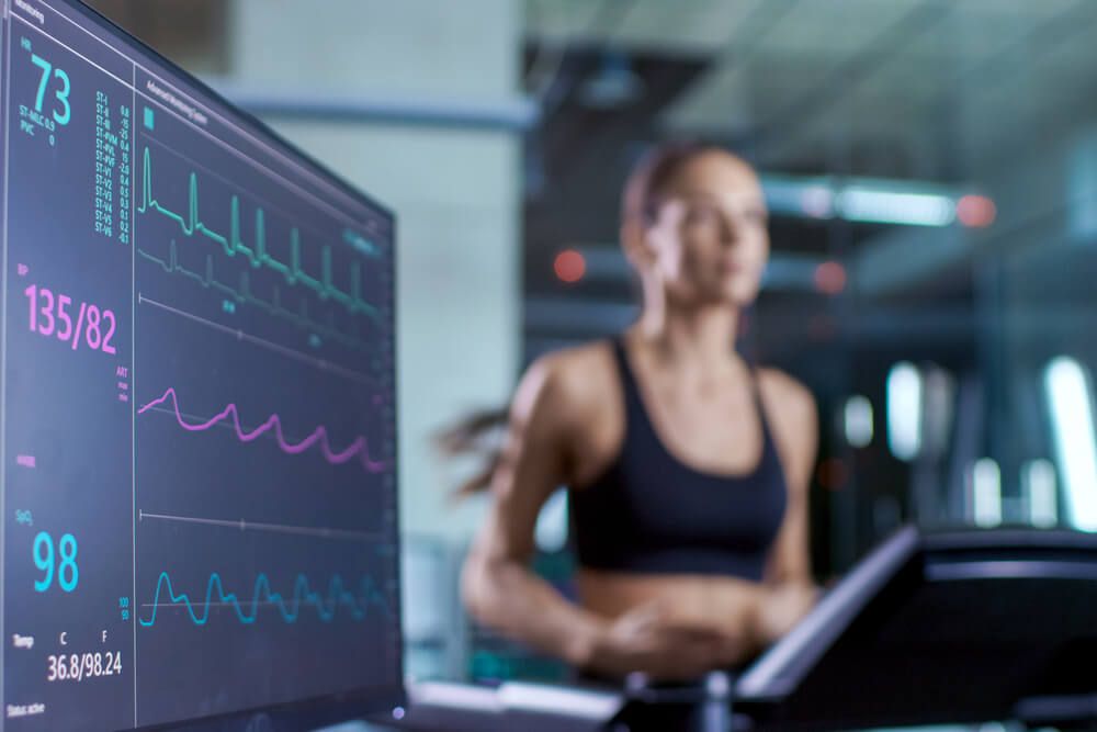 Woman Athlete Running on a Treadmill