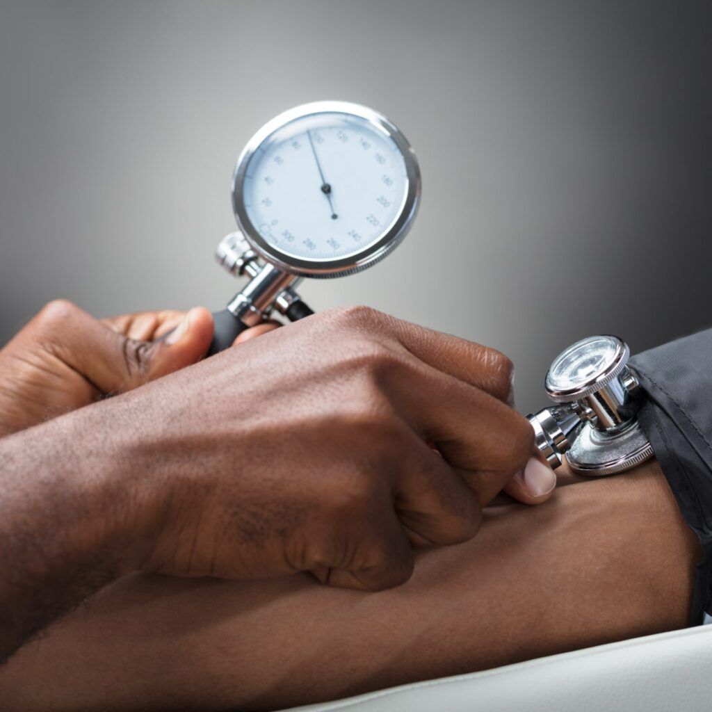 Close-up Of Male Doctor Measuring The Blood Pressure