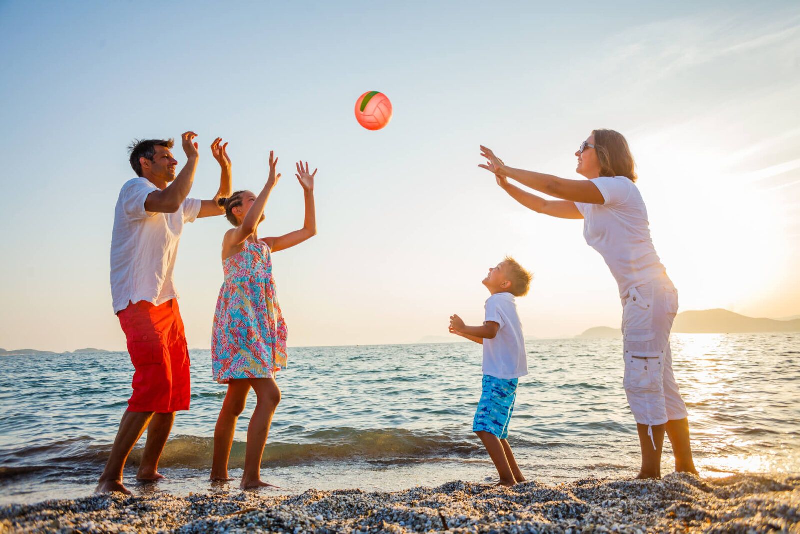 Family play on beach