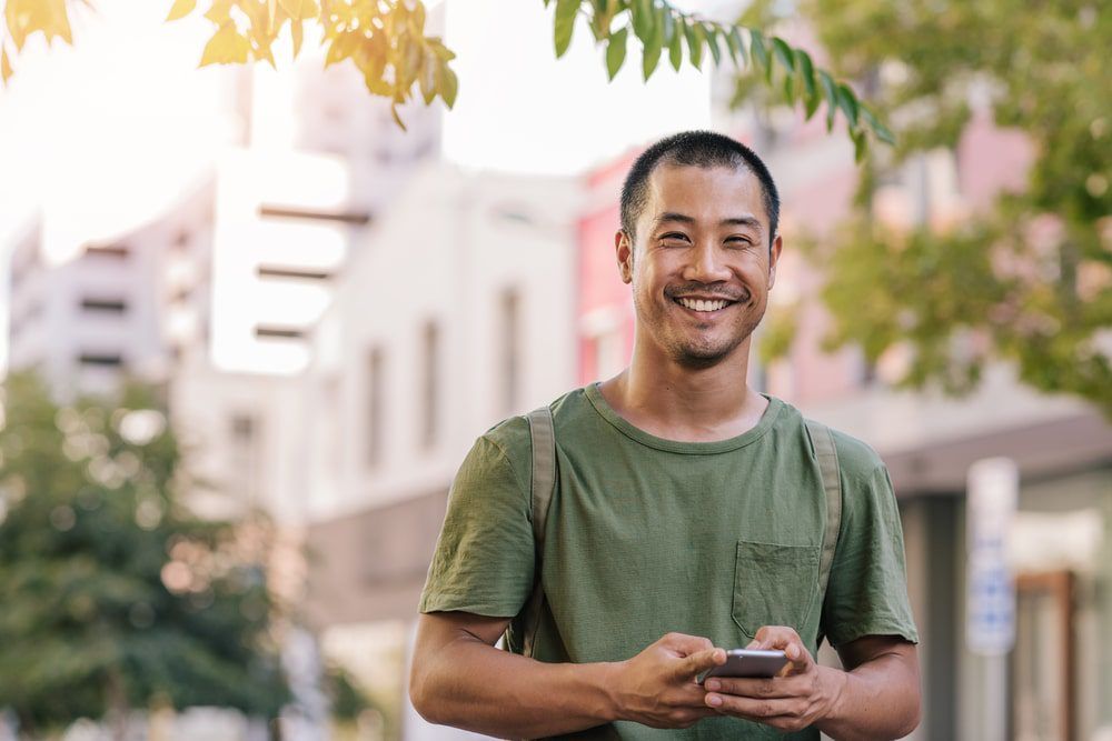 Asian Man in Green Shirt