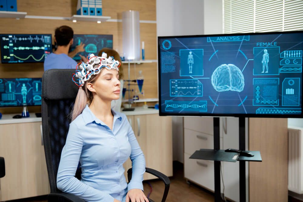 Female patient who is in a neurology clinic and her brain is being scanned